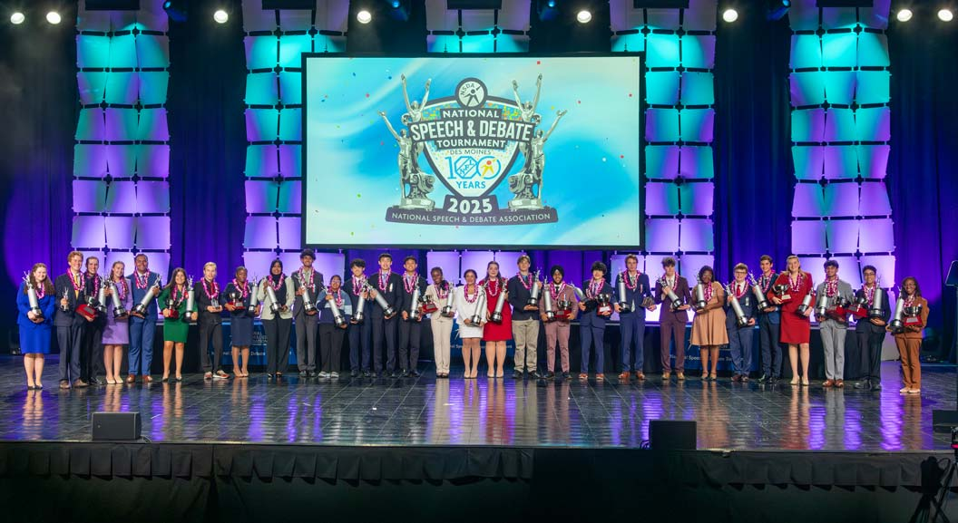 Award-winning students celebrating on stage at the National Speech & Debate Tournament
