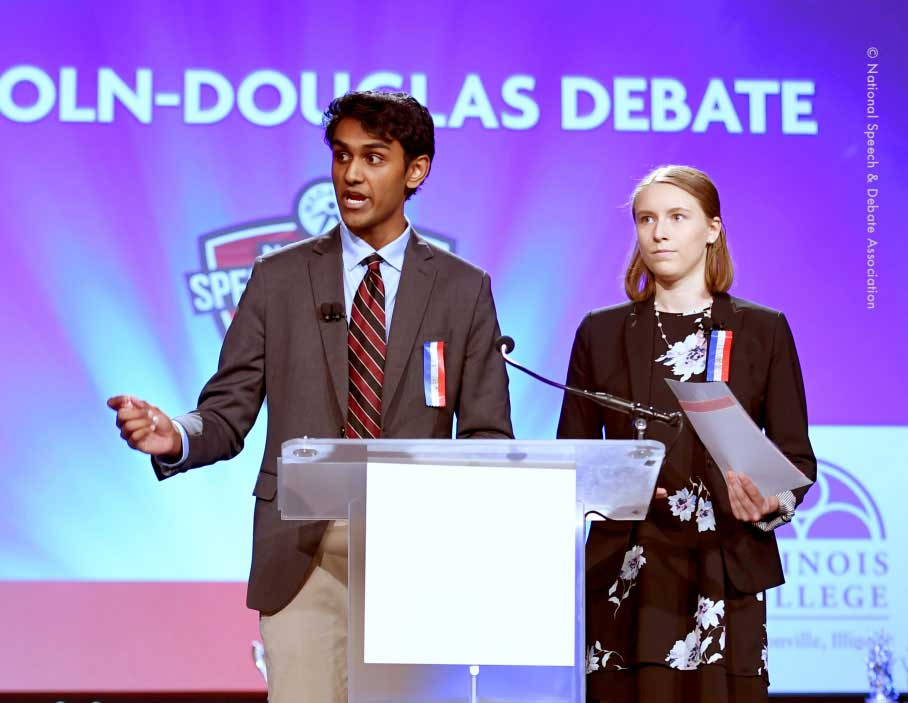 Two students competing in a Lincoln-Douglas debate round